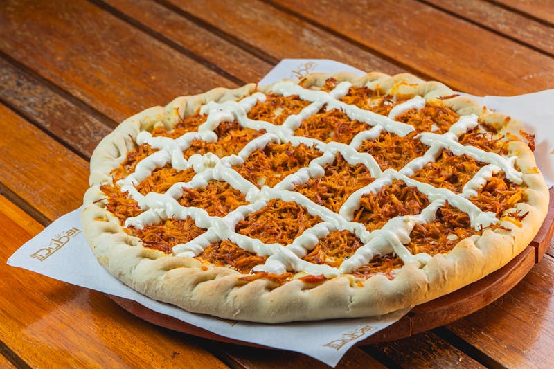 BBQ Smokehouse pizza with pulled chicken and smoked gouda