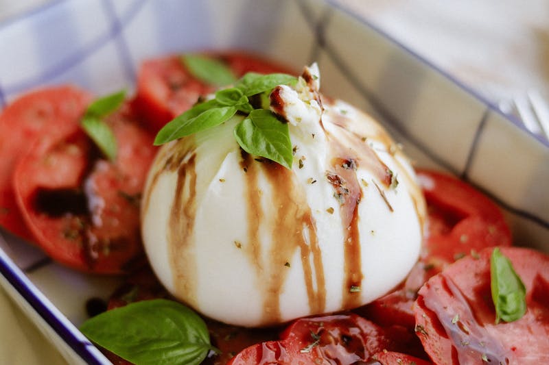 Burrata Caprese salad with heirloom tomatoes and fresh basil